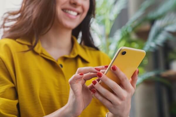 Girl with yellow mobile phone
