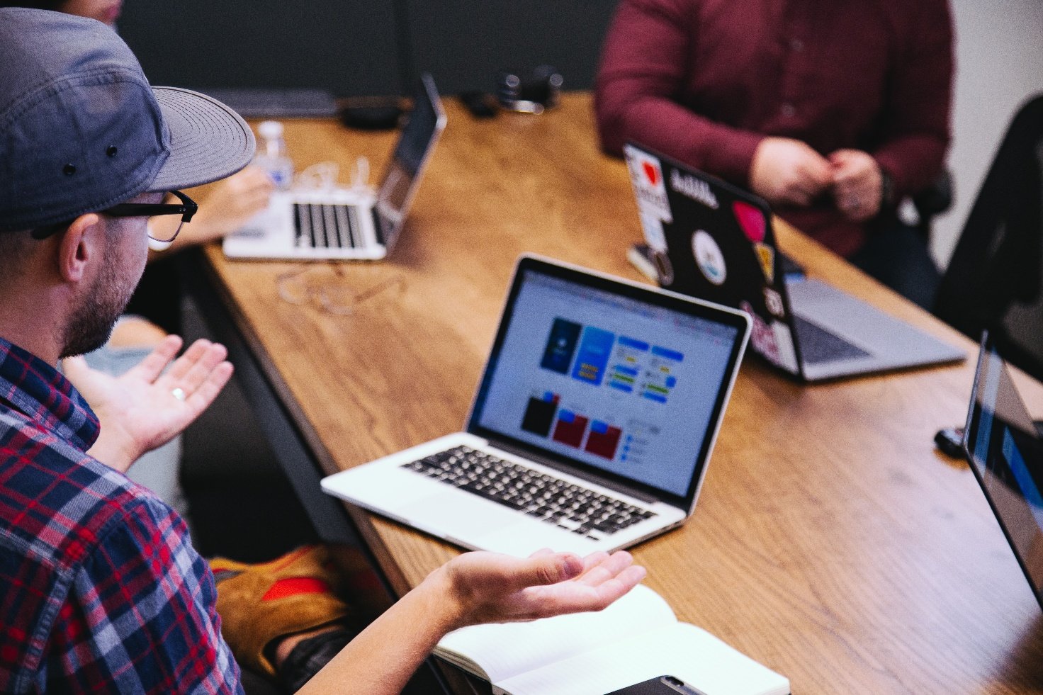 Computer and guy in cap
