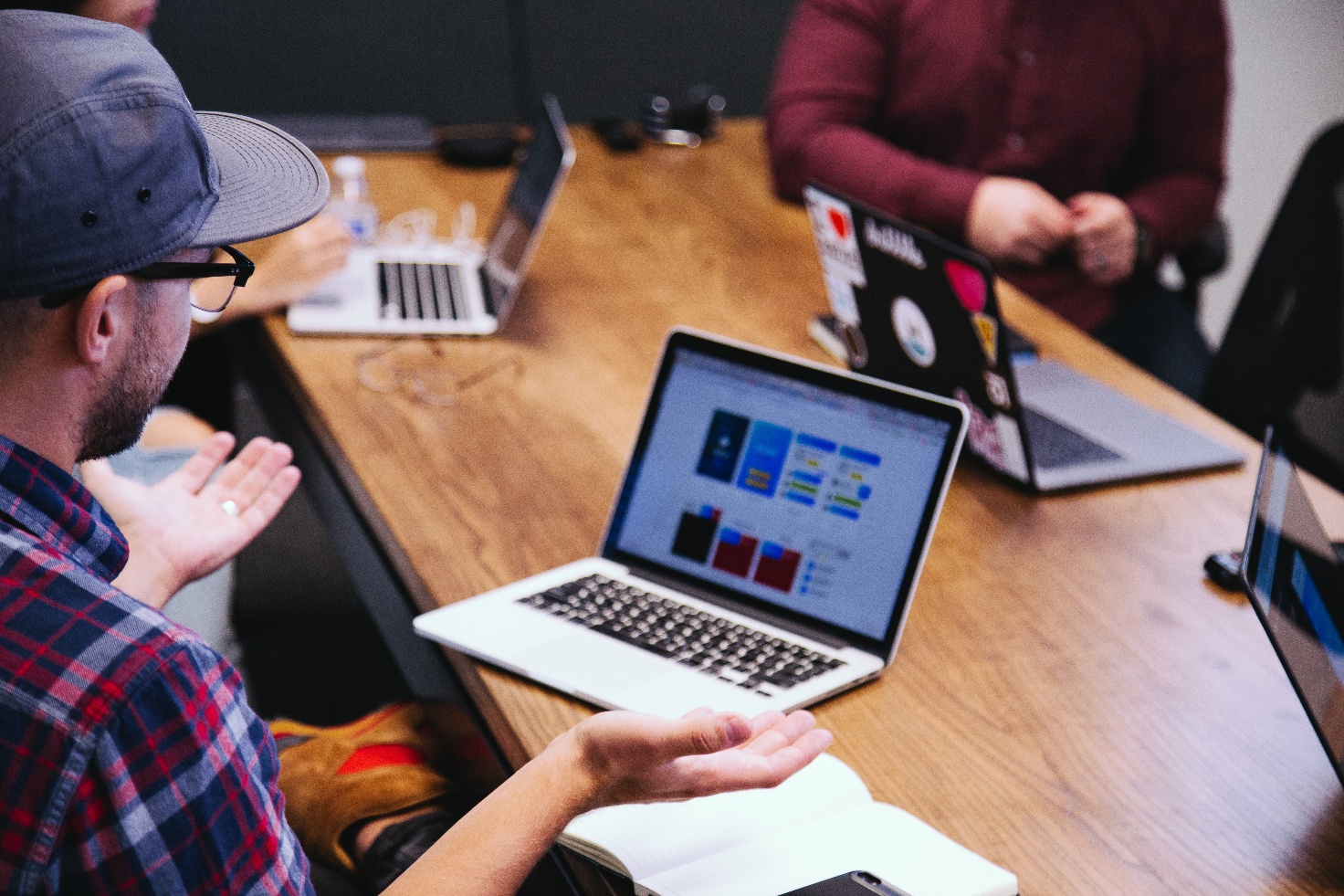 Computer and guy in cap