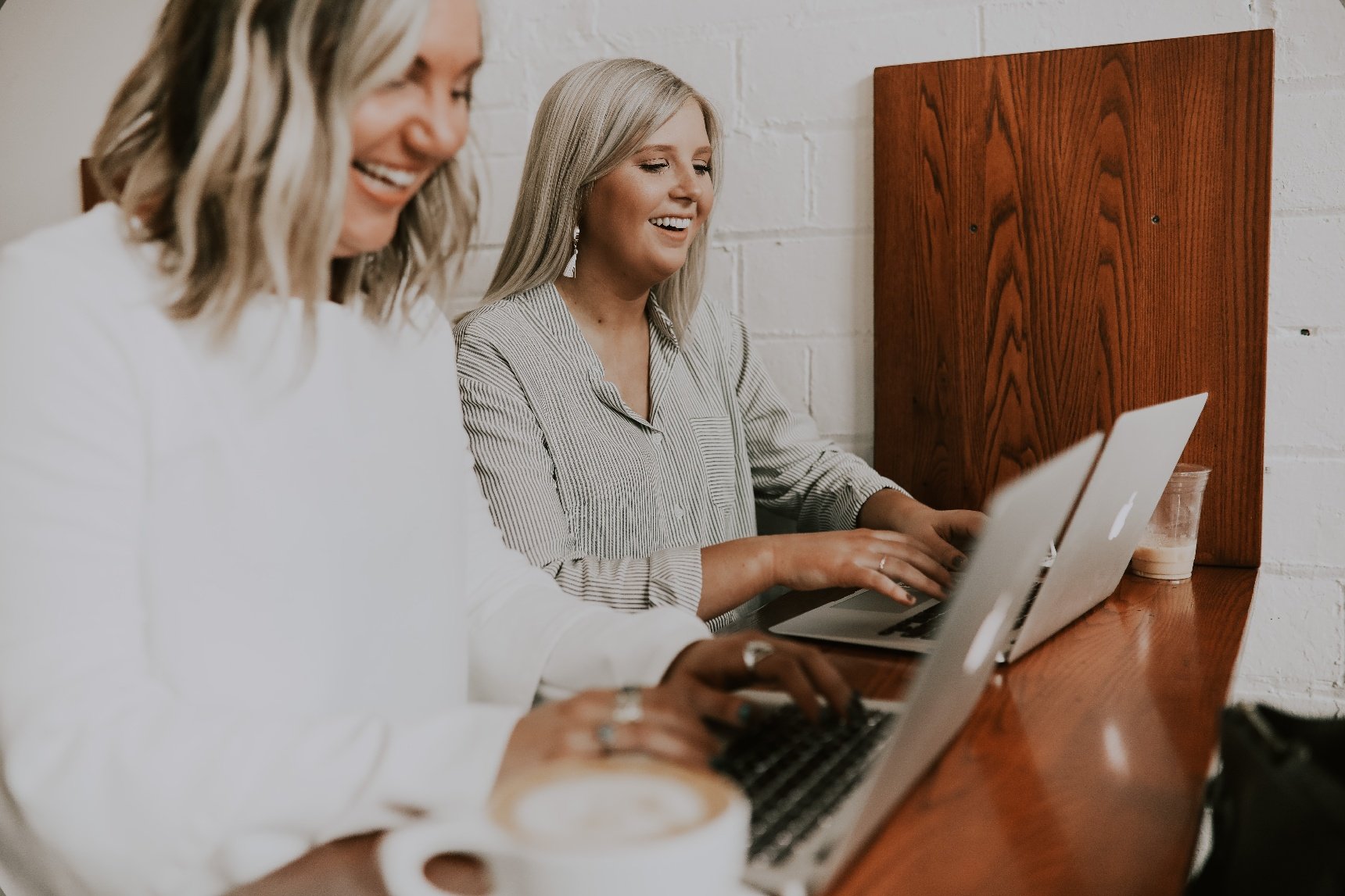 Two happy girls with computer